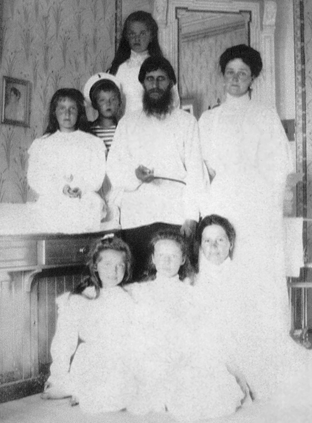Alexandra Feodorovna with her children and Rasputin